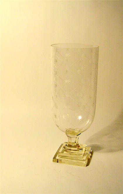 Appraisal: Glass hurricane lampWith diaper and star engraved decoration raised on