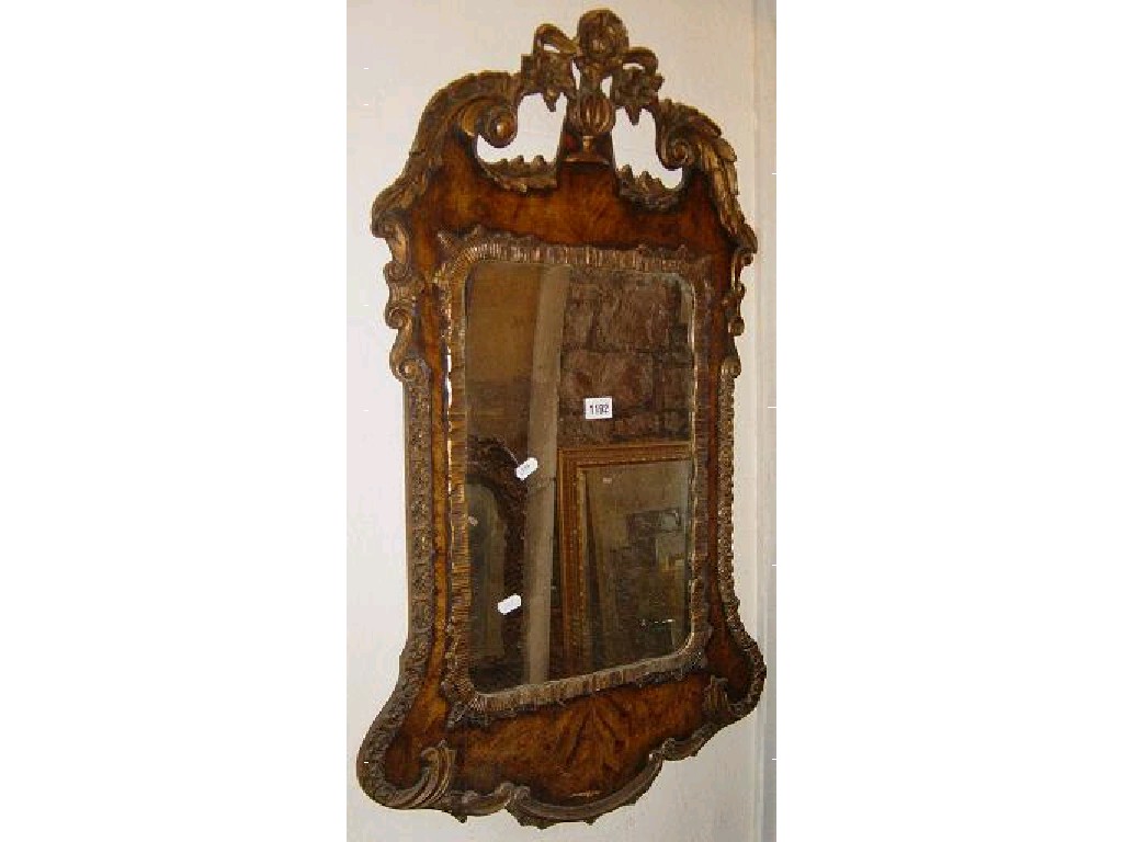 Appraisal: A pair of Georgian style walnut framed wall mirrors with