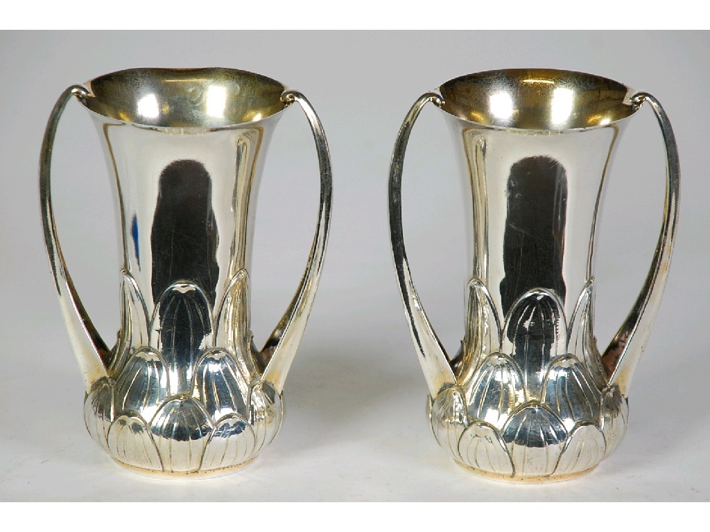 Appraisal: PAIR OF EARLY TWENTIETH CENTURY SILVER TWO HANDLED VASES with