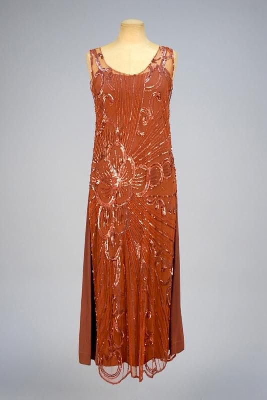 Appraisal: SEQUINED NET TABARD s Bronze tulle decorated with an off-center