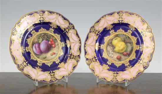 Appraisal: A pair of Royal Worcester fruit painted dessert plates by