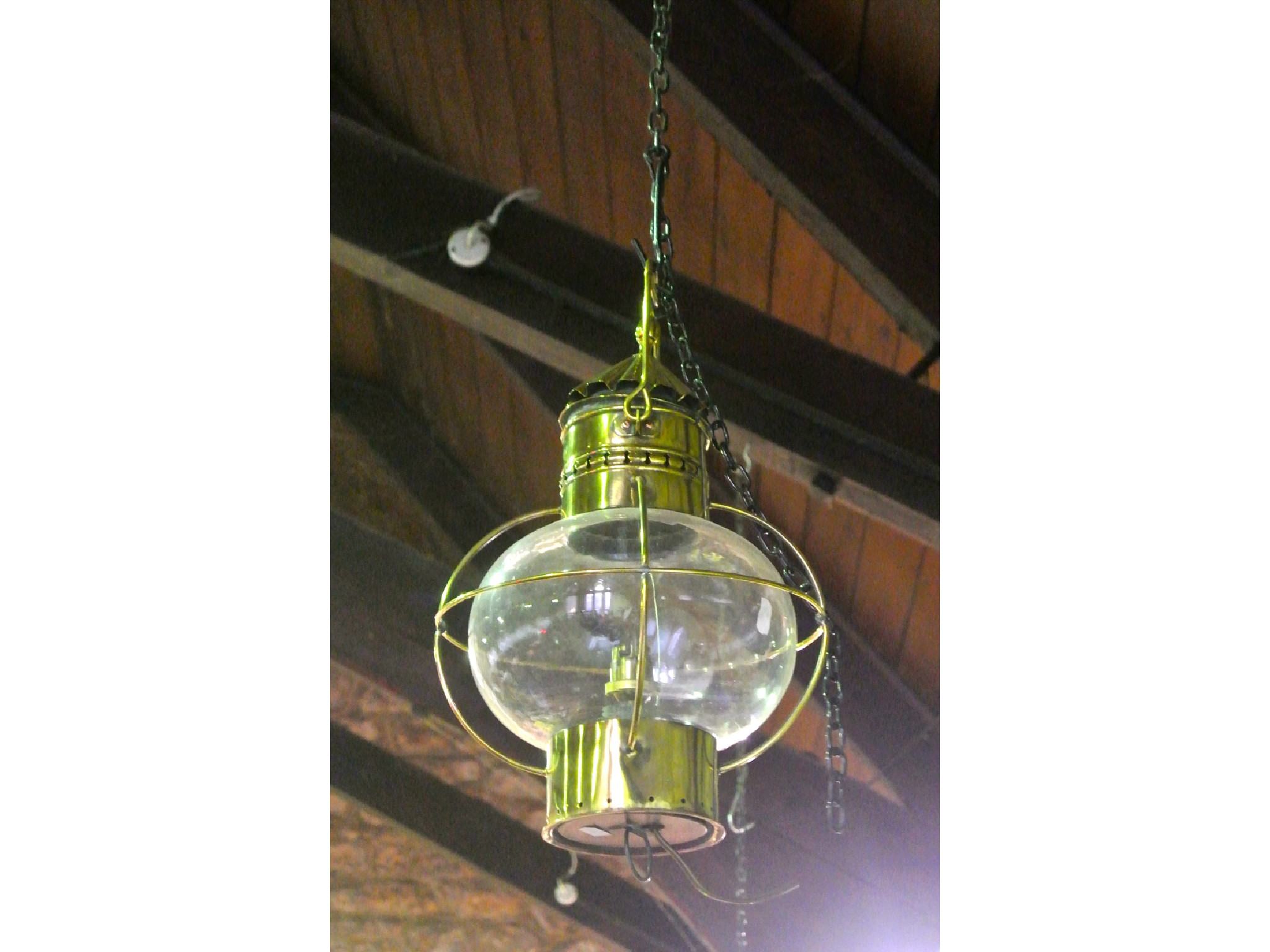 Appraisal: A brass ceiling lantern electrified with clear globular glass shade