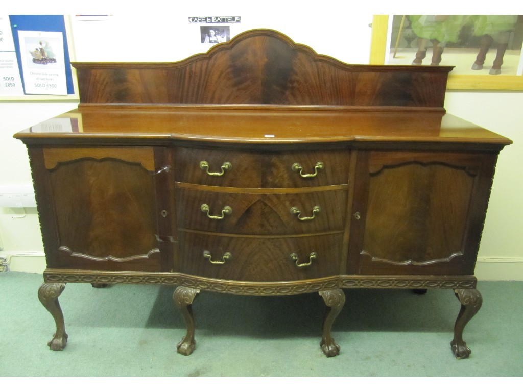 Appraisal: Mahogany sideboard raised on cabriole ball and claw supports