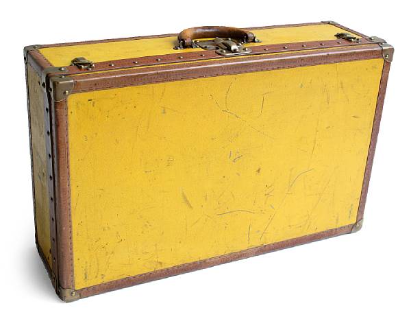 Appraisal: A Louis Vuitton yellow suitcase Bearing the initial H on