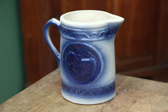 Appraisal: KITCHEN STONEWARE PITCHER Blue and white with cows on both