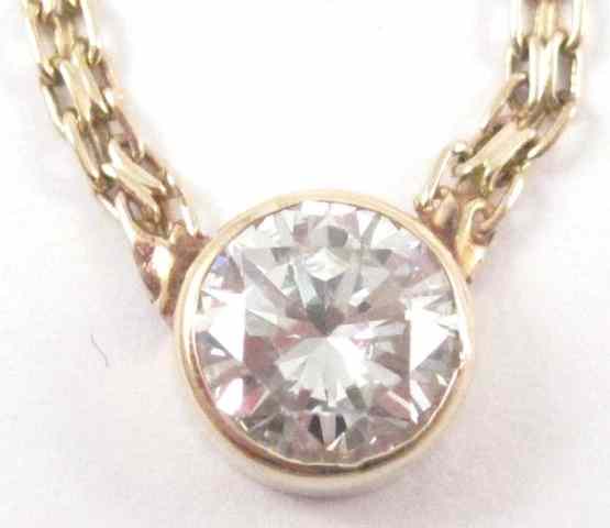 Appraisal: DIAMOND AND FOURTEEN KARAT GOLD NECKLACE set between two equal