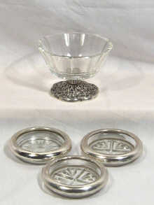 Appraisal: Three small glass coasters with silver rims marked sterling together