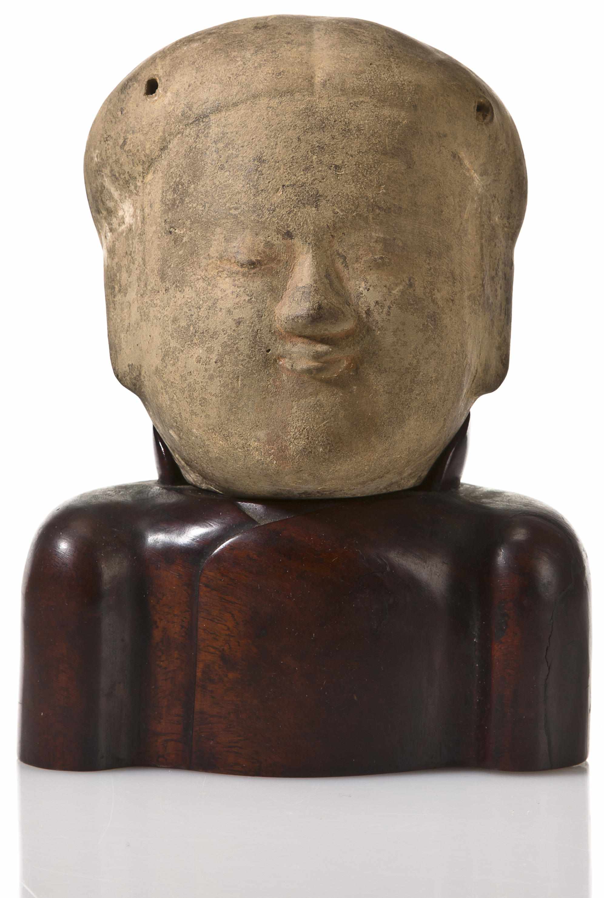 Appraisal: A pottery bust of a manHan Dynasty Depicted with serene