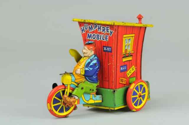 Appraisal: HUMPHREY MOBILE Wyandotte Toy Mfg colorful tin litho auto features