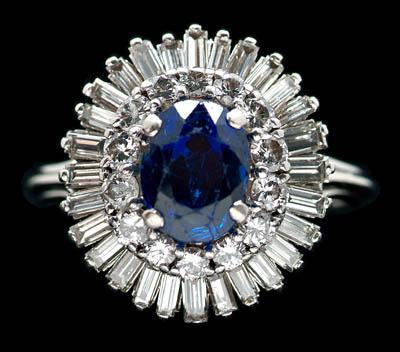 Appraisal: Sapphire and diamond ring one oval faceted intense blue sapphire