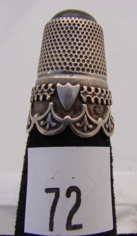 Appraisal: German silver thimble with smooth red stone on top