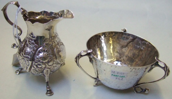 Appraisal: Silver comprising a triple handled sweetmeat bowl with beaten decoration