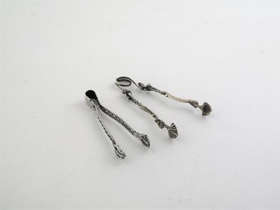 Appraisal: A pair of th century sugar tongs spring action with