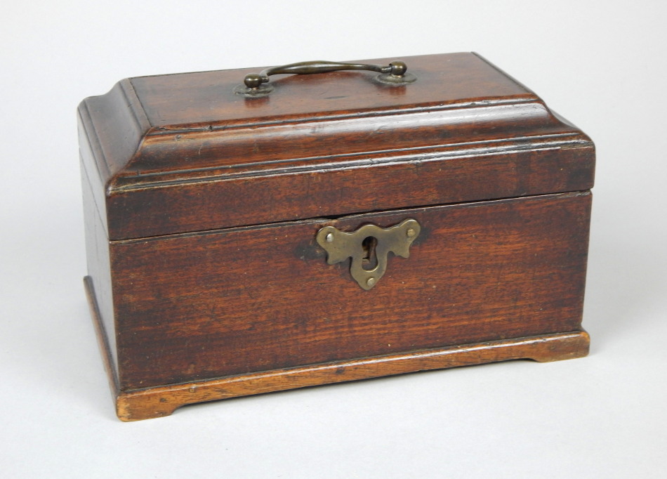 Appraisal: A George III mahogany tea caddy with loop handle and