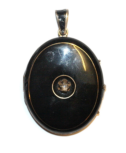 Appraisal: A DIAMOND SET OVAL ENAMEL AND GILT MOURNING LOCKET central