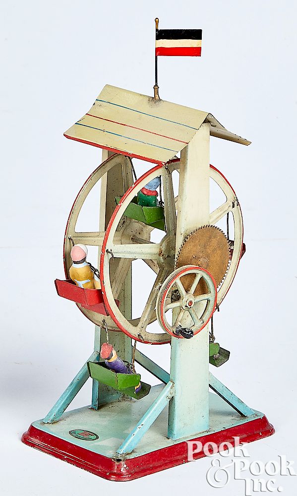 Appraisal: Doll painted tin Ferris wheel steam toy accessory Doll painted