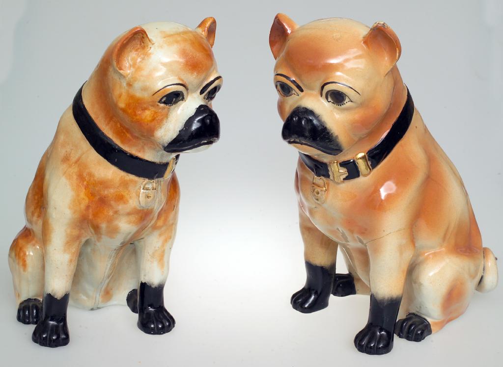 Appraisal: LARGE PAIR OF STAFFORDSHIRE POTTERY MODELS OF PUGS c each