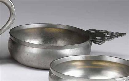 Appraisal: Pewter porringer rhode island type The shaped handle with geometric