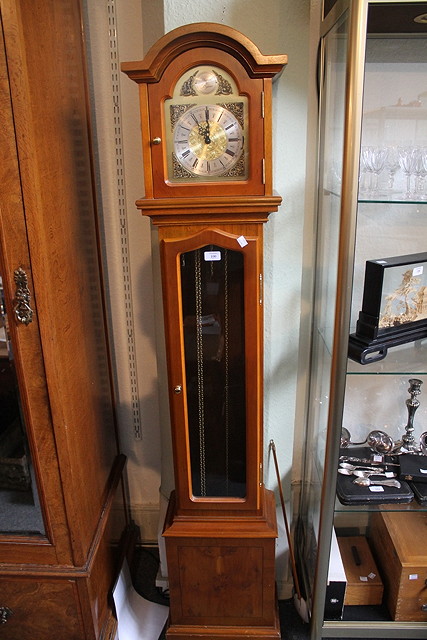 Appraisal: A MODERN YEW GRANDMOTHER CLOCK the arched gilt dial with