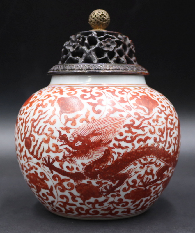 Appraisal: Chinese Iron Red Dragon Jar with Carved Lid Chinese squat