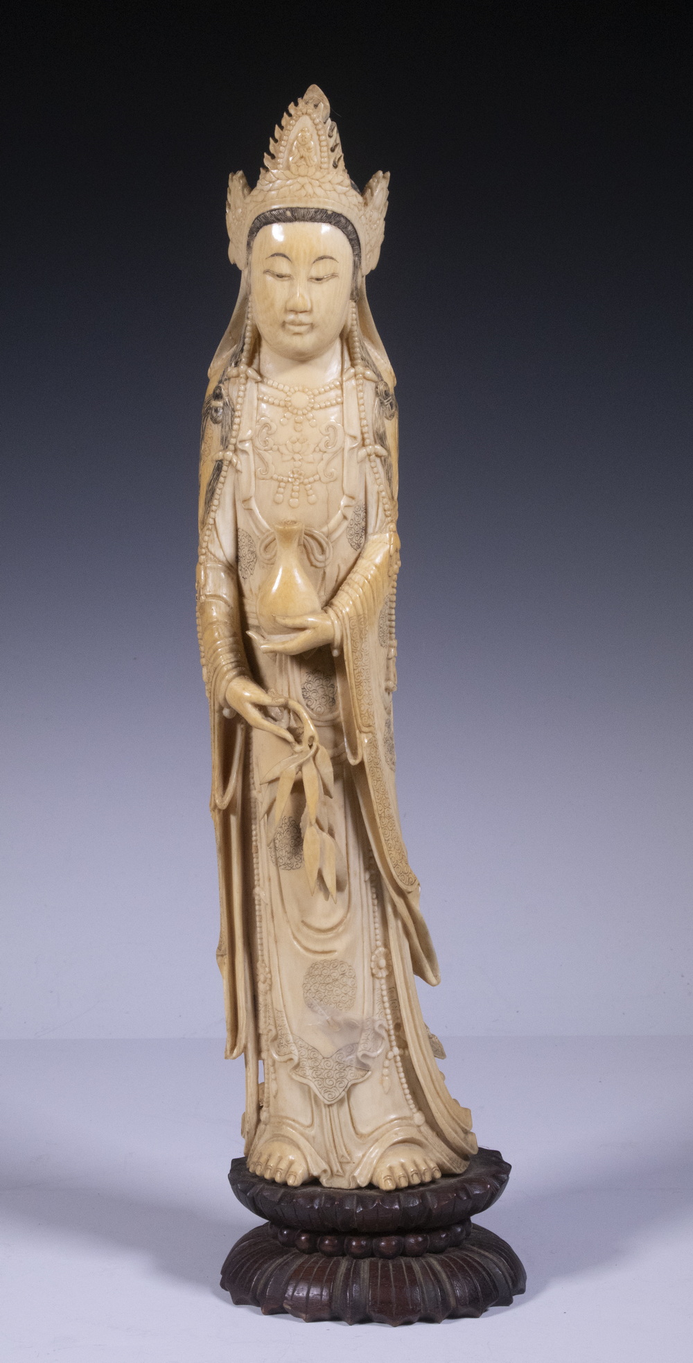 Appraisal: LARGE TH C CHINESE IVORY FIGURE OF QUANYIN The Confucian