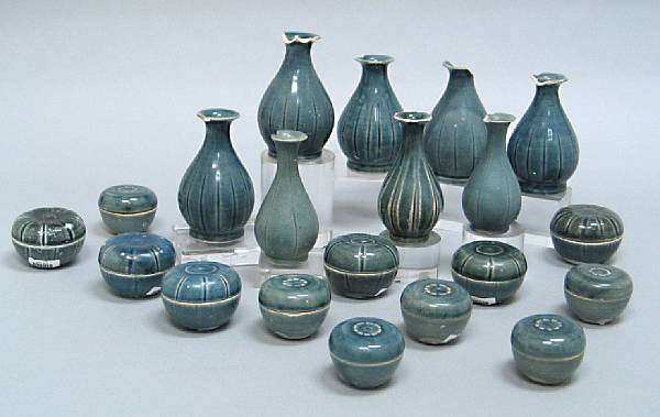 Appraisal: A selection of twenty blue glazed bottles and boxes Late