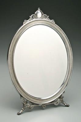 Appraisal: Silver plated oval mirror Eastlake style wooden back and stand