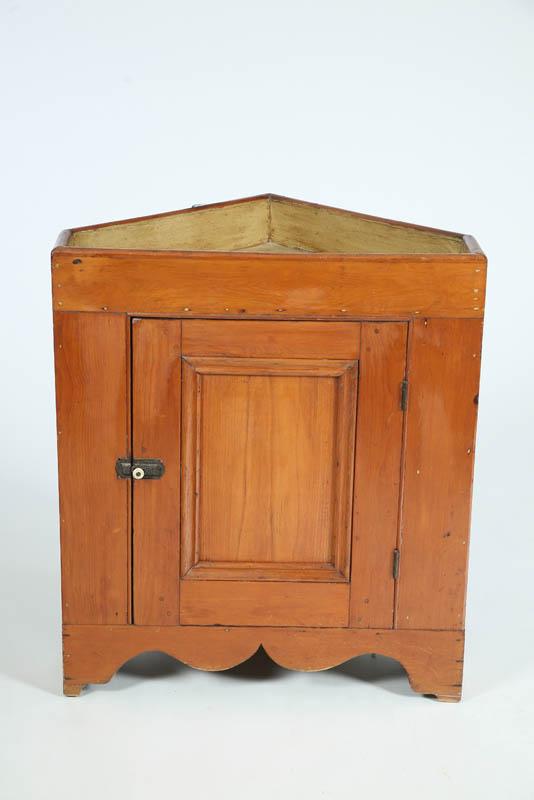 Appraisal: CORNER DRYSINK Pine with a paneled door and interior shelf