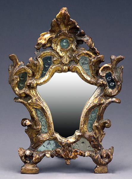 Appraisal: An Italian Rococo style carved silvered wood mirror th century