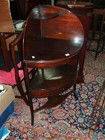 Appraisal: A Georgian mahogany corner washstand with a central section with