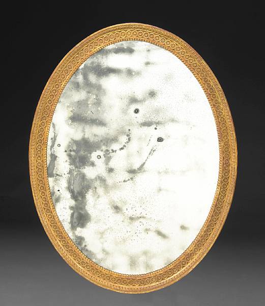 Appraisal: A George III style carved giltwood mirror circa The oval