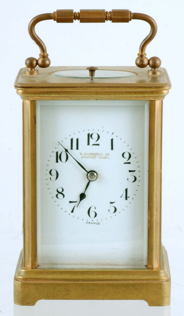 Appraisal: A French carriage clock Brass case with beveled glass Enameled