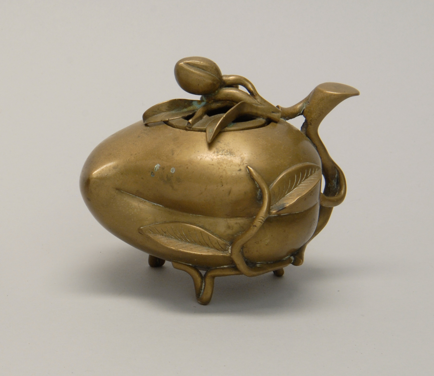 Appraisal: BRONZE CENSER th CenturyIn peach form with pierced fruit and