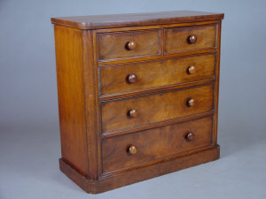 Appraisal: A Victorian chest of drawers the rounded top over two