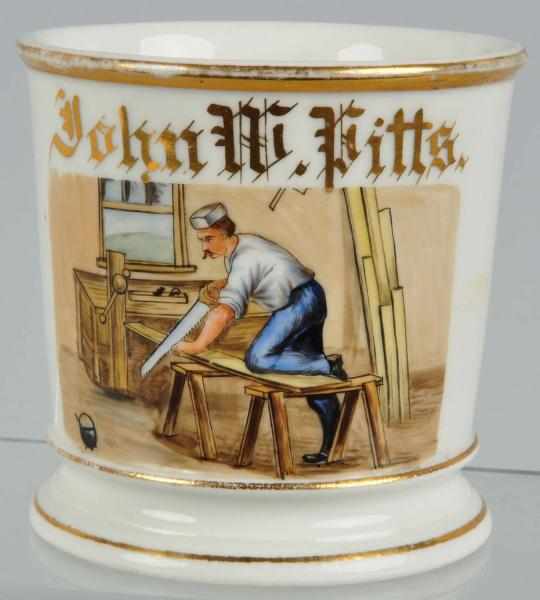 Appraisal: Carpenter's Shaving Mug Description Nice image of man cutting a