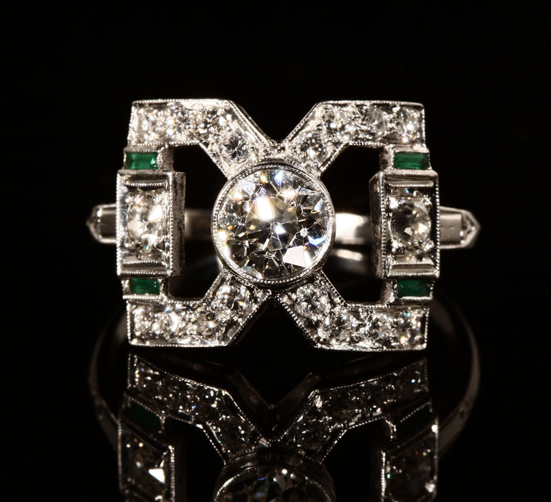 Appraisal: An Art Deco platinum old European-cut diamond and emerald ring