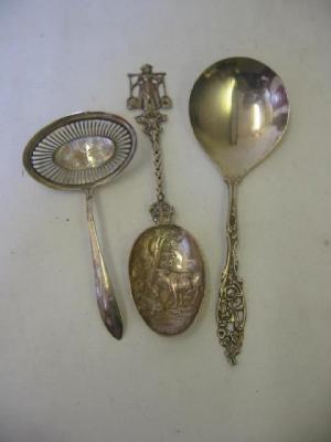 Appraisal: A CONTINENTAL SUGAR SIFTER LADLE with oval bowl and chased