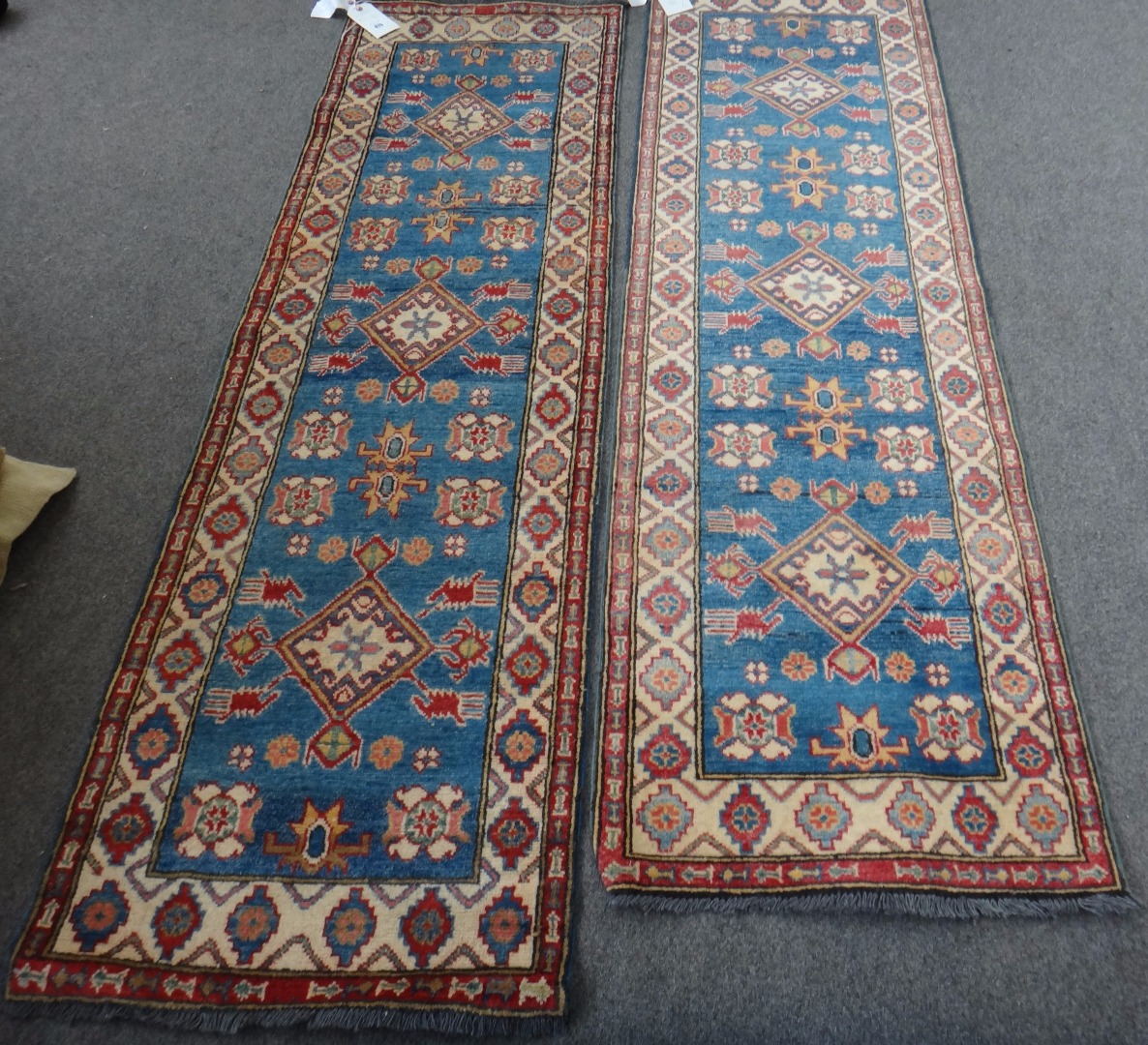 Appraisal: A pair of Shirvan runners each indigo field with three