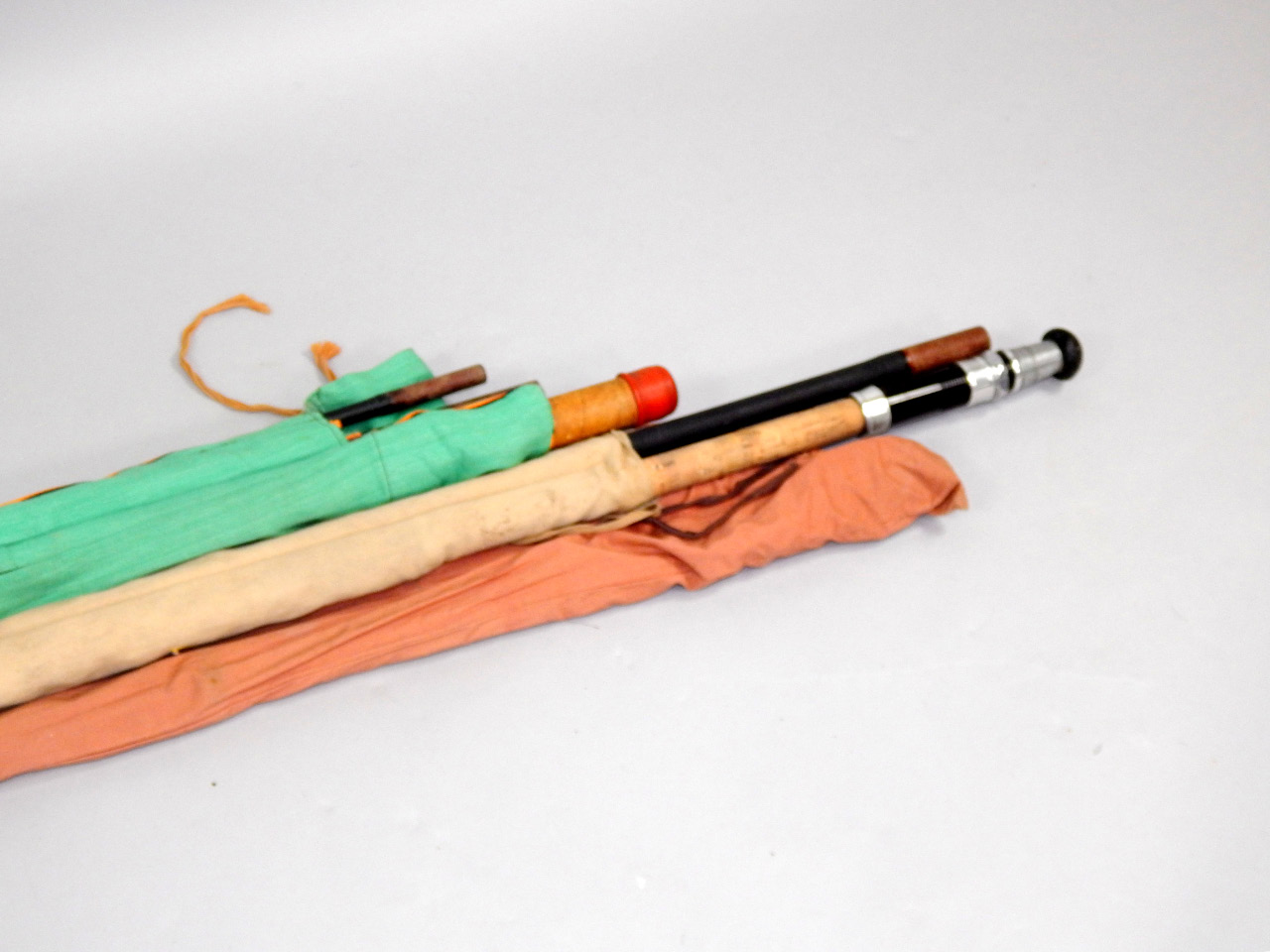 Appraisal: Two piece hollow fibre glass float fishing rods handmade by