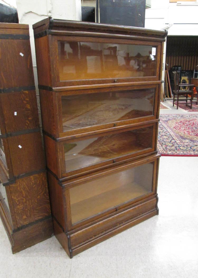 Appraisal: STACKING OAK BOOKCASE American early th century having four stacking