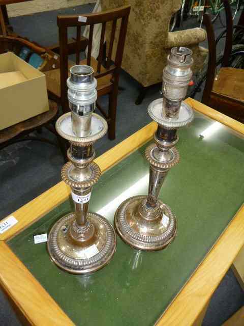 Appraisal: A PAIR OF OLD SILVER PLATED CANDLESTICKS converted for use