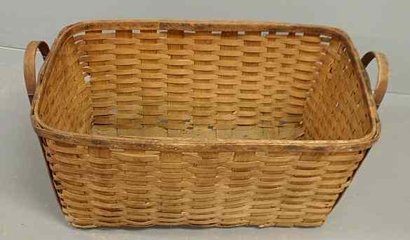 Appraisal: Large rectangular woven splintwood basket with handles h x w