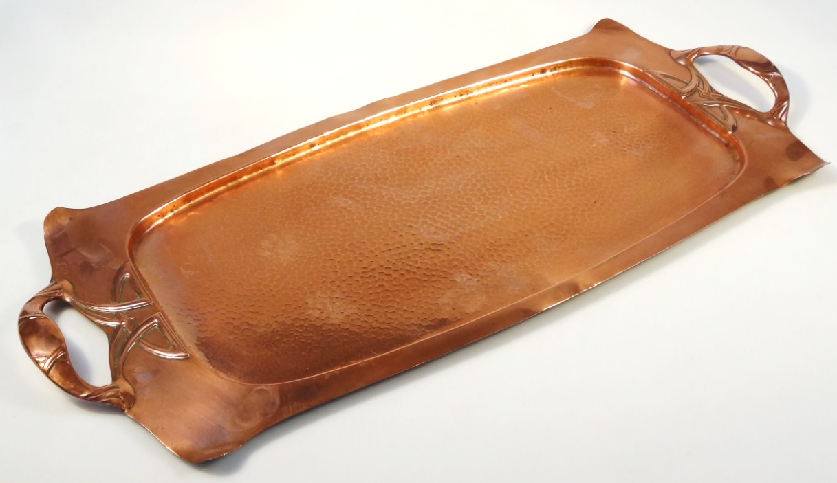 Appraisal: A thC Art Nouveau design copper tray the shaped outline