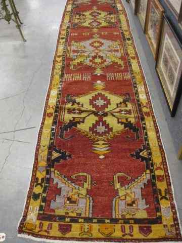 Appraisal: Oushak Persian Handmade Runner geometric medallions yellow red trim '