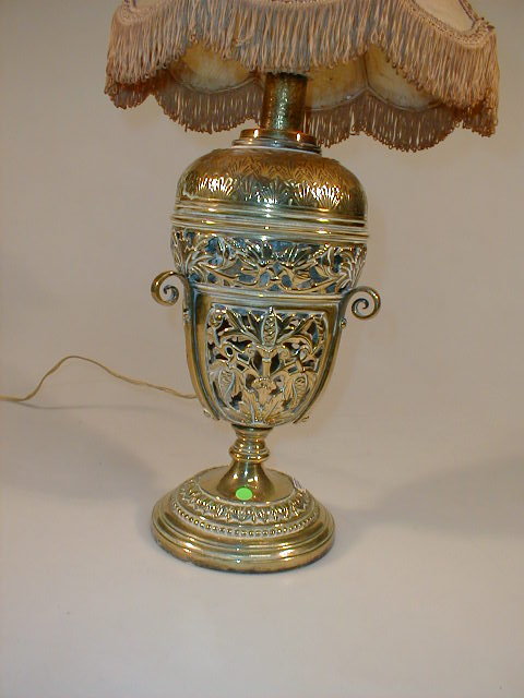 Appraisal: A Victorian pierced brass table oil lamp with detachable reservoir