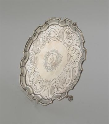 Appraisal: A George II waiter with a shaped and moulded border