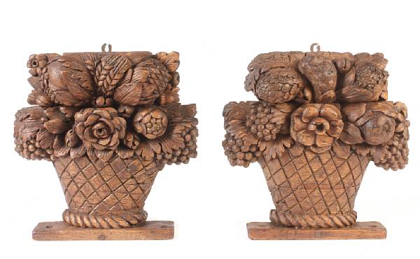 Appraisal: A pair of French carved beech floral baskets height in