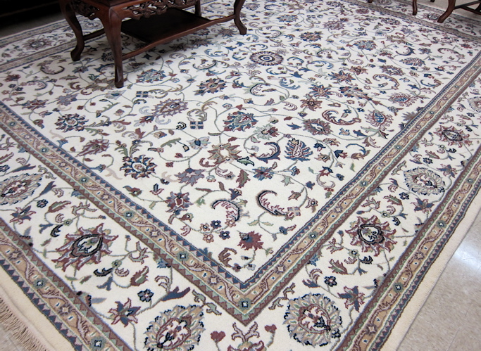 Appraisal: HAND KNOTTED ORIENTAL CARPET Indo-Persian overall meandering vine decoration on