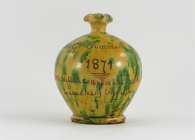 Appraisal: A dated Donyatt pottery moneybox decorated in a mottled yellow