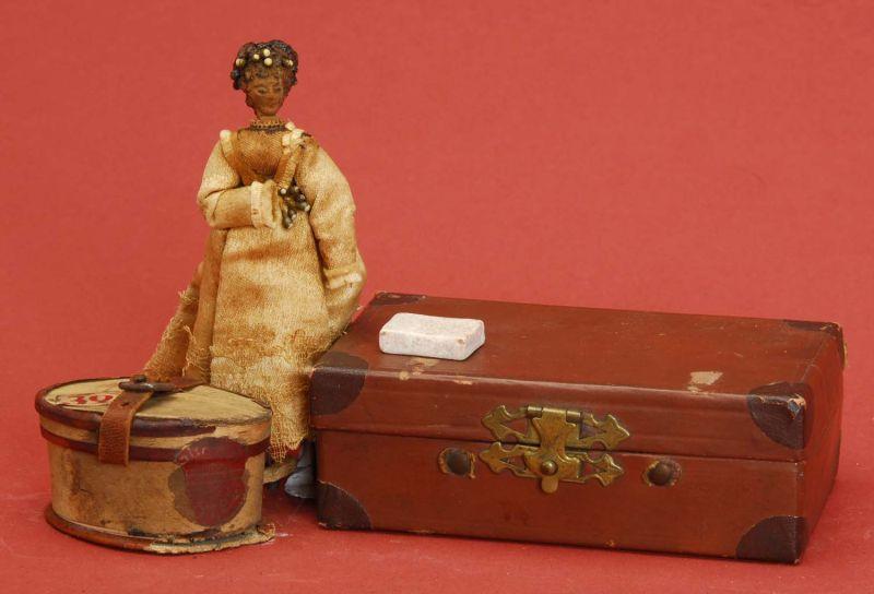 Appraisal: Lot Suitcase with Cloth Doll Hat Box Lot includes cardboard